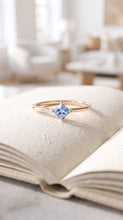 Load image into Gallery viewer, MiShelli princess cut aquamarine solitaire ring in 14K gold, featuring a sparkling center stone and sleek band design.