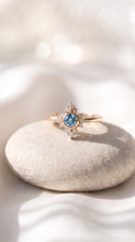 Load image into Gallery viewer, 14K gold aquamarine diamond halo ring with a central aquamarine gemstone surrounded by sparkling diamonds, designed by MiShelli.