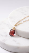 Load image into Gallery viewer, Gold-filled garnet solitaire necklace with a central red garnet gemstone on a delicate chain by MiShelli.