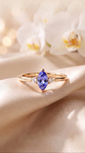 Load image into Gallery viewer, Marquise Tanzanite ring with diamond accents in 14K gold, showcasing elegant gemstone and sparkling detailing.