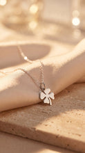 Load image into Gallery viewer, Sterling silver shamrock necklace with a clover pendant, designed by MiShelli, featuring a delicate and elegant jewelry style.