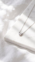 Load image into Gallery viewer, White sapphire tiny solitaire silver necklace featuring a small gemstone setting on a sleek silver chain.