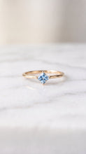 Load image into Gallery viewer, Princess cut aquamarine solitaire ring in 14K gold with a sleek band and elegant design by MiShelli.